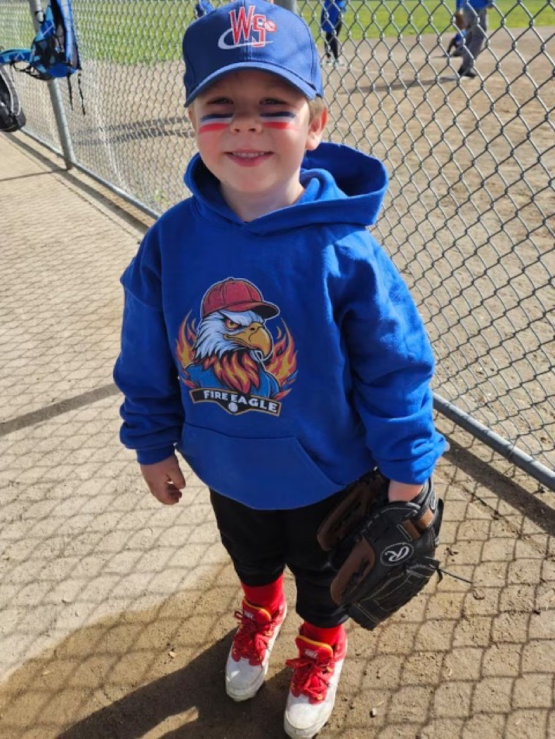 Kid wearing Fire Eagle hoodie
